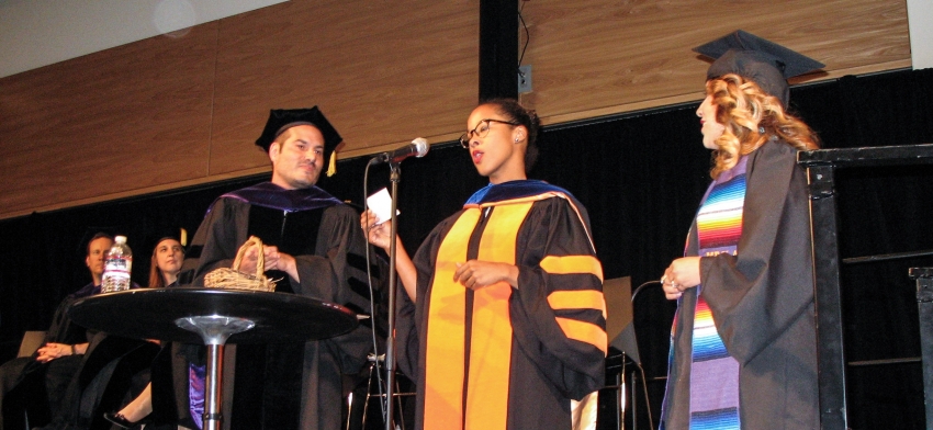 Professor Victor Menaldo and Professor Megan Francis lead the recognition for graduating seniors.