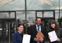 David Owens and his students celebrate outside the courthouse after wrongfully convicted Patrick Prince was exonerated.