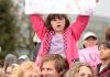 Brian Wahlberg gives daughter Luciena a good view of the proceedings as the crowd sings at Cal Anderson Park in Seattle.